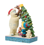 Bumble Holding Rudolph by Tree