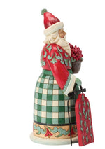 Highland Santa Standing Next To Sled Figure