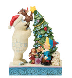Bumble Holding Rudolph by Tree